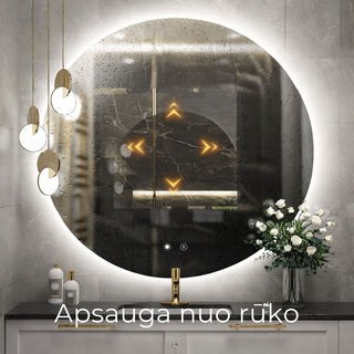 Apvalus vonios veidrodis su aktyvuota apsauga nuo rasojimo, matomi vandens lasai ir veikimo indikacijos simboliai.